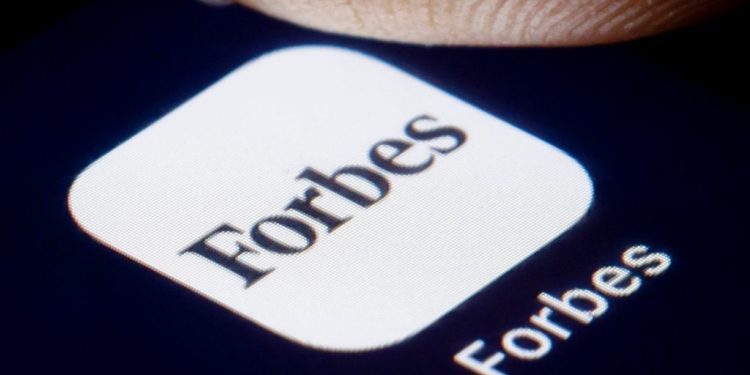 Berlin, Germany - February 19: In this photo illustration, the logo of the US business magazine Forbes is displayed on a smartphone on February 19, 2019 in Berlin, Germany. 
(Photo by Thomas Trutschel/Photothek via Getty Images)