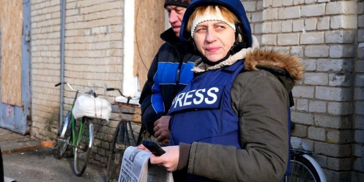 Svitlana Karpenko, editor-in-chief of Trudova Slava newspaper - practically the only source of information in Orikhiv - distributes a newspaper in a front-line town