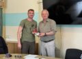 Presentation of the NUJU member certificate by the head of the NUJU's Rivne regional organization, Dmytro Tarasiuk, to Colonel Oleh Dombrovskyi