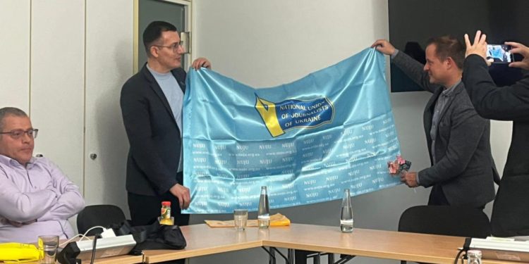 Flag of Gratitude: NUJU Presents Symbol of Partnership to German Colleagues in Berlin 1 597865346 25500918416233015 6049769905041734445 n