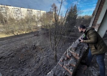 Shell crater following a missile explosion near a school in Lviv, western Ukraine
