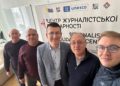 Scott Douglas Jacobsen (right) with editors Vasyl Myroshnyk, Oleksii Pasiuha, and Kostiantyn Hryhorenko, and NUJU President Sergiy Tomilenko (centre) at the Journalists' Solidarity Centre in Kyiv, April 2026