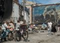 People walk past a heavily damaged shopping centre in Kyiv, Ukraine, on 24 May 2026, after Russian strikes. Credit: Ori Aviram / Middle East Images via AFP.