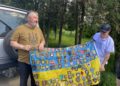 "Journalist's Happiness": How British Volunteers and a Ukrainian Priest Helped the Editor of Vorskla Deliver the Newspaper to Readers 8 British volunteers are coming to Ukraine for the 36th time. The flag features the chevrons of the units they helped. Photo provided by Oleksii Pasiuha